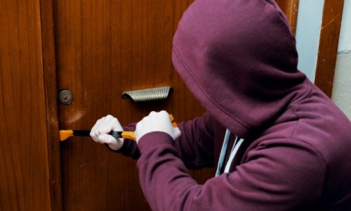 Thief Trying to Open a lock Burglary Prevention