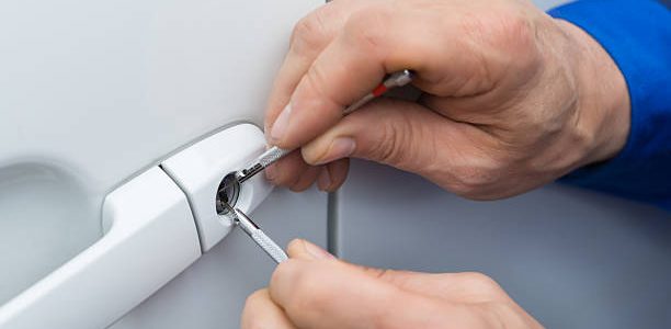 Close-up Of Person Hand Holding Lockpicker To Open Car Door car locksmith