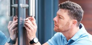 locksmith checking a lock